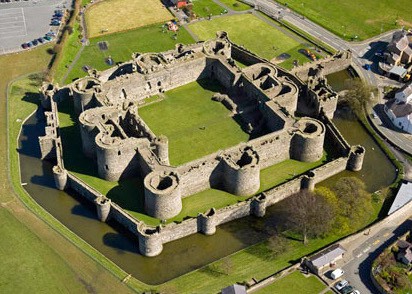 Aerial view of Beaumaris Castle, showing multiple layers of walls for defense. Crown copyright 2016.